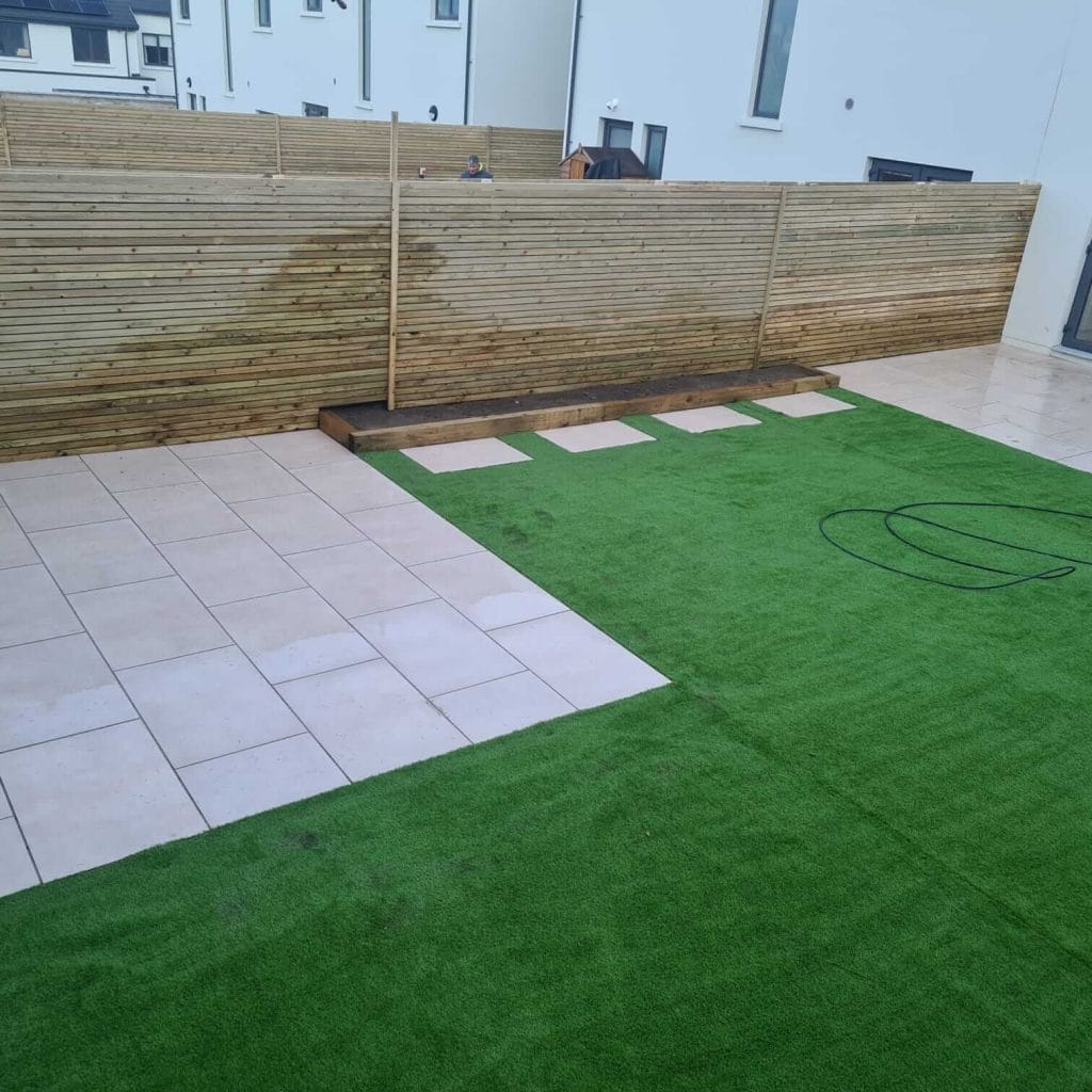 fake grass and timber fence installation