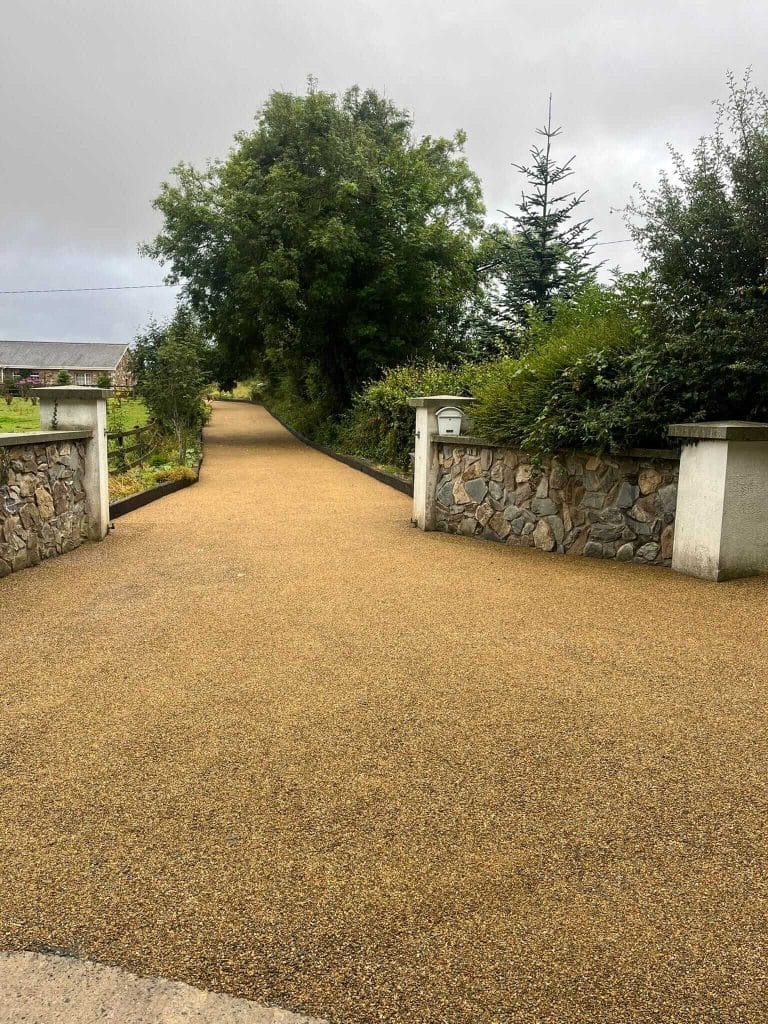 stone driveway leading up to house
